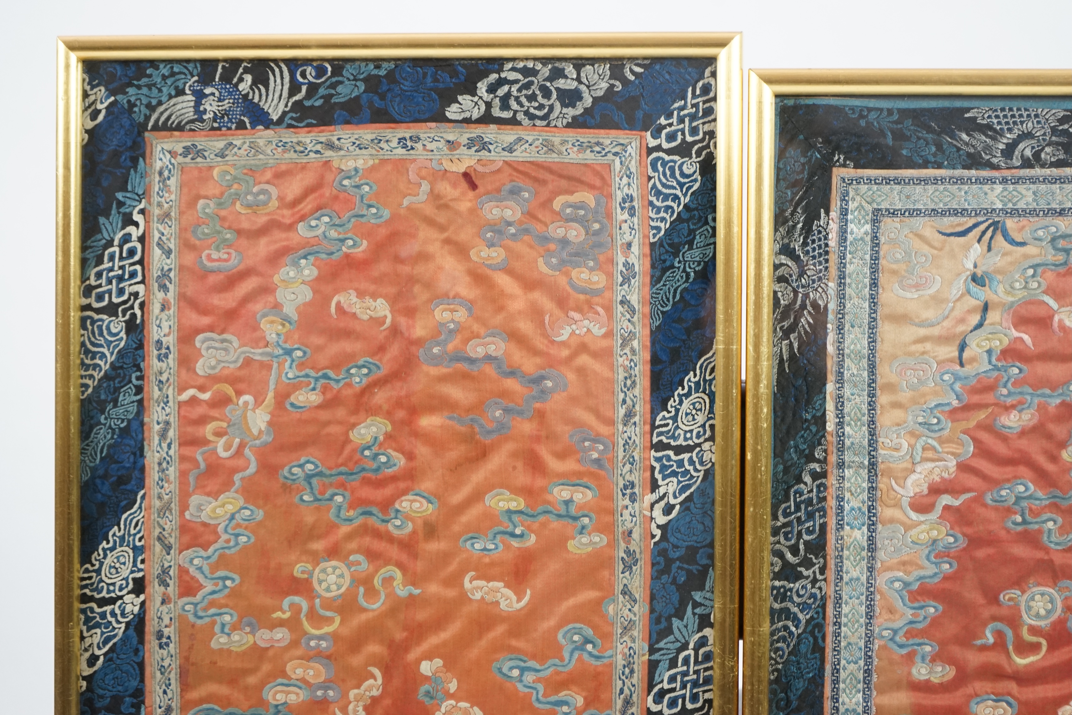 A pair of Chinese coral silk ‘dragon’ panels, 19th century